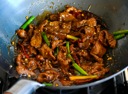 Mongolian beef and sweet corn jollof rice go together!
