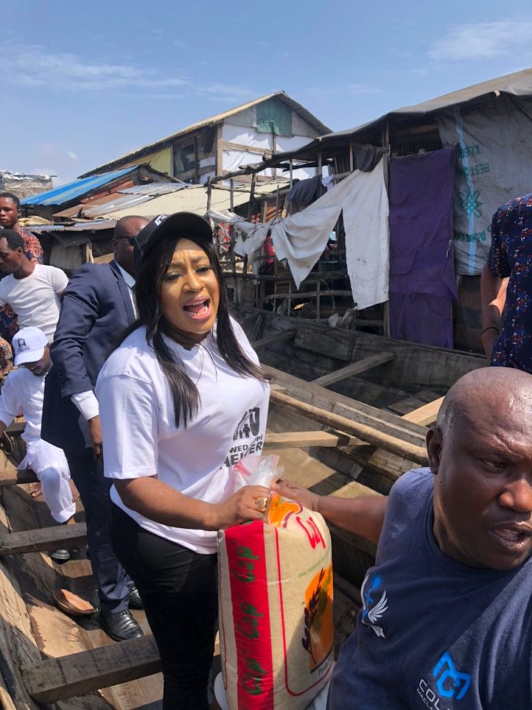 PHOTOS: Nigerians react as Humanitarian Minister shares food, holds health outreach