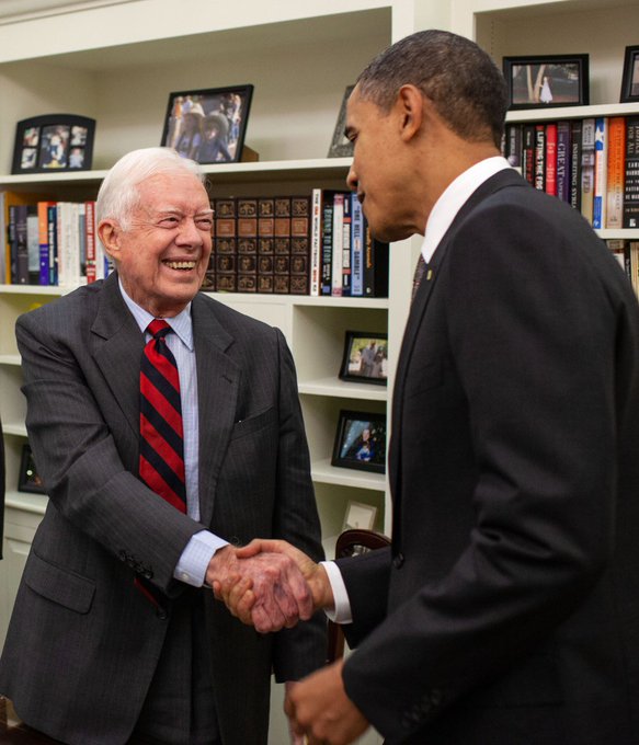 Obama greets ex-President Carter on 99th birthday