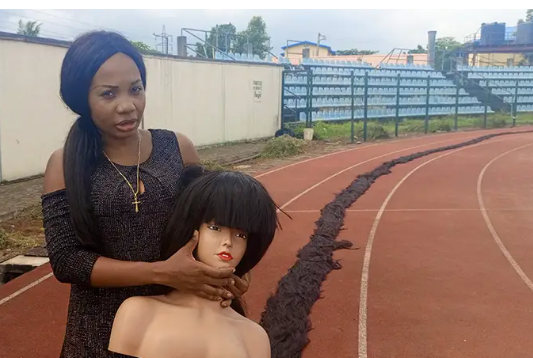 After 11 days and spending over N2m, Helen Williams creates world’s longest wig
