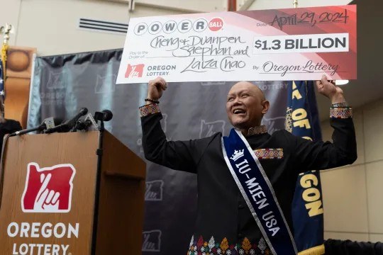 I’ll keep playing, says immigrant cancer patient who won $1.3bn jackpot