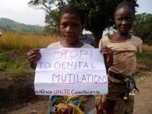 A young girl protests against genital mutilation